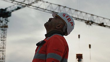 Construction worker looking up